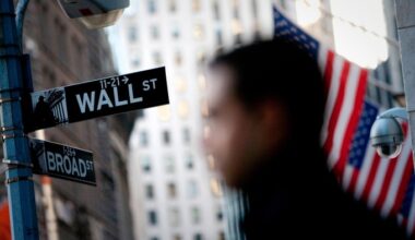 A close-up of a Wall Street street sign
