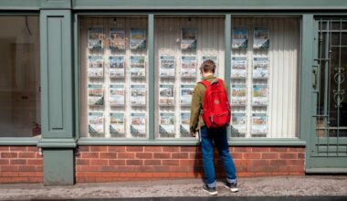 A person looks through the window of an estate agent in Birmingham