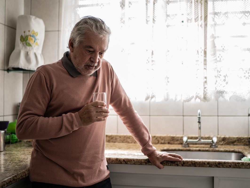 Senior man feeling pain at home