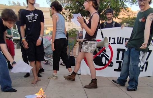 Israeli teenagers burning draft orders in Central Tel-Aviv