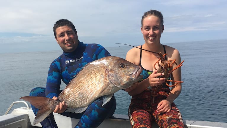 Jamie Newell and partner Melissa Churchouse. Newell says dredging tailings will wipe out a swathe of the area's reef fisheries.