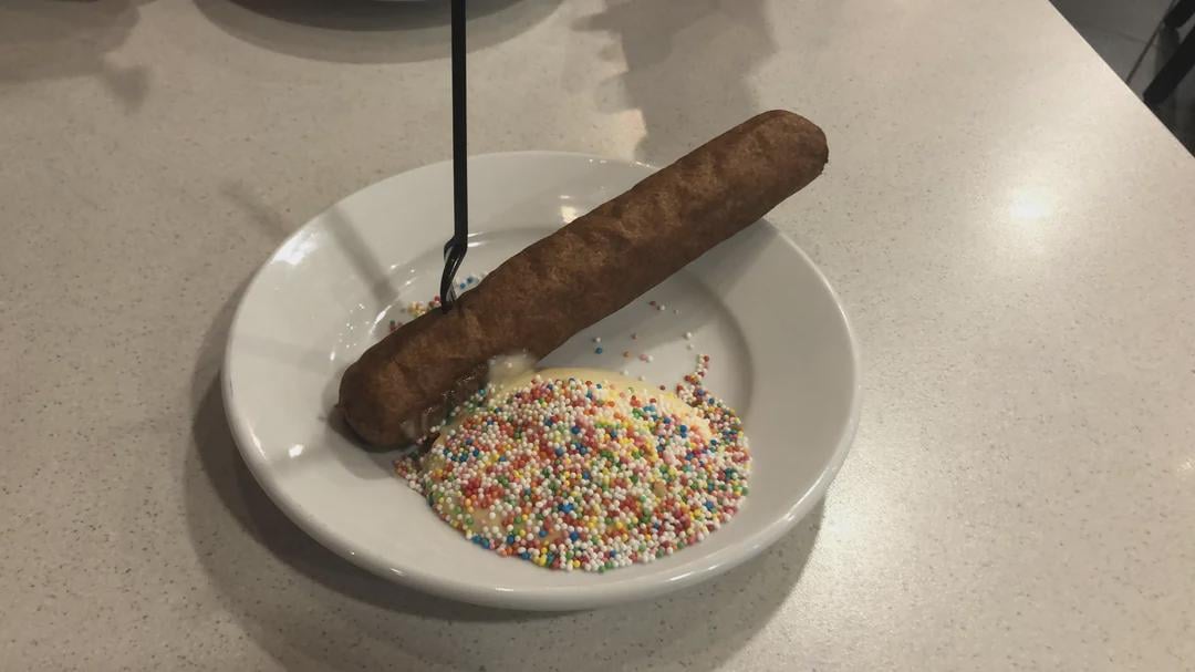 A certified Dutch culinary banger: the Discodel, a Frikandel with mayonaise and sugar sprinkles. PIGS are awfully quiet all of a sudden.