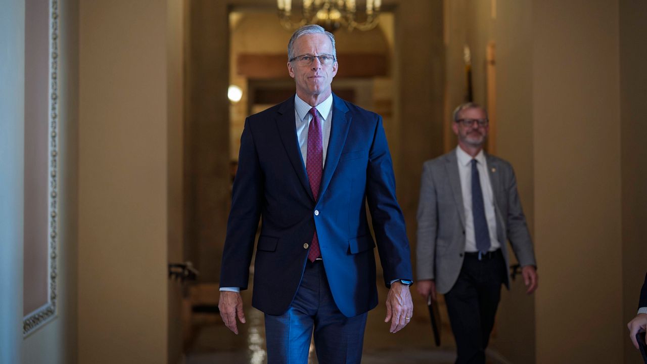 Senate Majority Leader John Thune, R-S.D., walks to the chamber as Senate Republicans work to pass President Donald Trump's big bill of tax breaks, spending cuts by his July Fourth deadline, at the Capitol in Washington, Sunday, June 29, 2025. (AP Photo/J. Scott Applewhite, file)