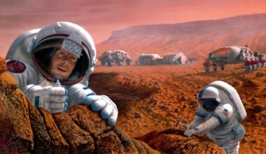 Two astronauts in space suits move around on Mars