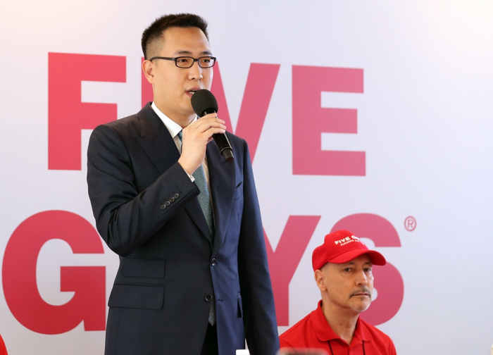 Kim Dong-seon, the third and youngest son of Hanwha Group Chairman Kim Seung-youn, speaks at the launch of Five Guys Korea in June 2023 (Courtesy of FG Korea)