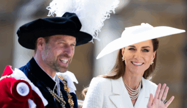 Kate Middleton and Prince William waving from a carriage