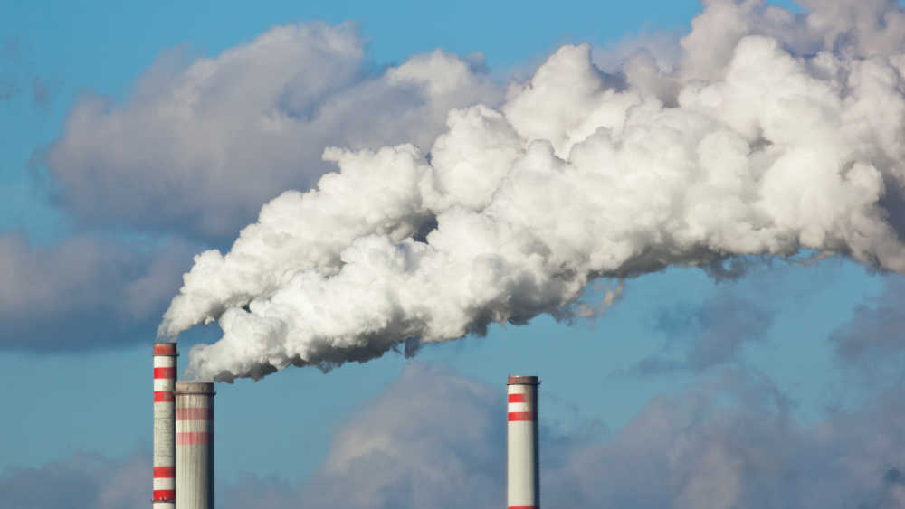 3 chimneys and smoke.