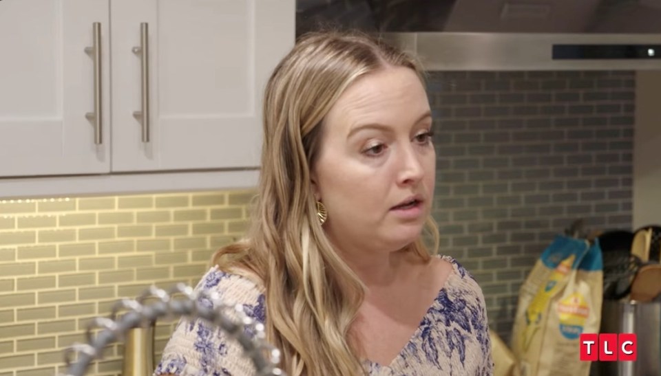 Elizabeth from 90 Day Fiancé looking concerned in her kitchen.