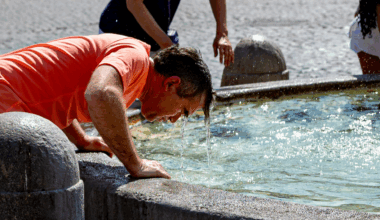 Man cools off at the Piazza del Popolo in Rome, Italy, during the heatwave