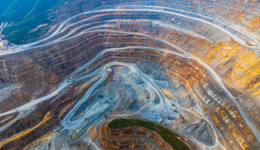 Aerial view of excavators and transport vehicles busy with work at Dexing Copper Mine on August 16, 2024 in Shangrao, Jiangxi Province of China.