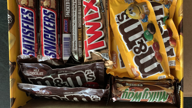 box of M&M's, Snickers bars, Twix bars, and Milky Way bars