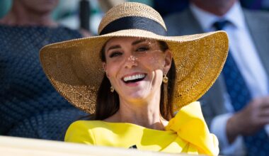 Catherine, Princess of Wales smiles, wearing a sunhat, in the royal box during the Men's Doubles Final at Wimbledon 2022