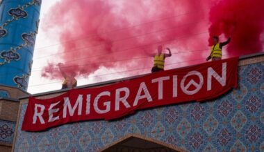 Protesters on the rooftop of Copenhagen's largest mosque demand remigration on July 18, 2025.
