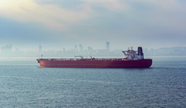 Laden crude oil tanker approaches the port of Qingdao, China in the morning fog. Photo credit: Shutterstock/Igor Grochev