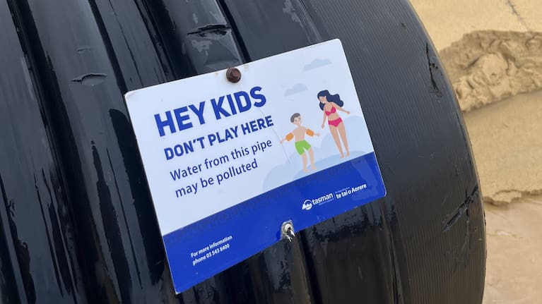 Signs have previously been fixed to the pipe to tell kids not to plan in the stormwater which might be contaminated. Photo: Supplied/Bradley Reichert