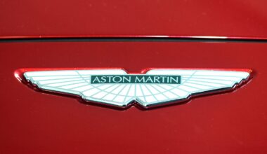 The Prince of Wales places a logo on the new Aston Martin DBX at the new Aston Martin Lagonda factory in Barry, Wales.