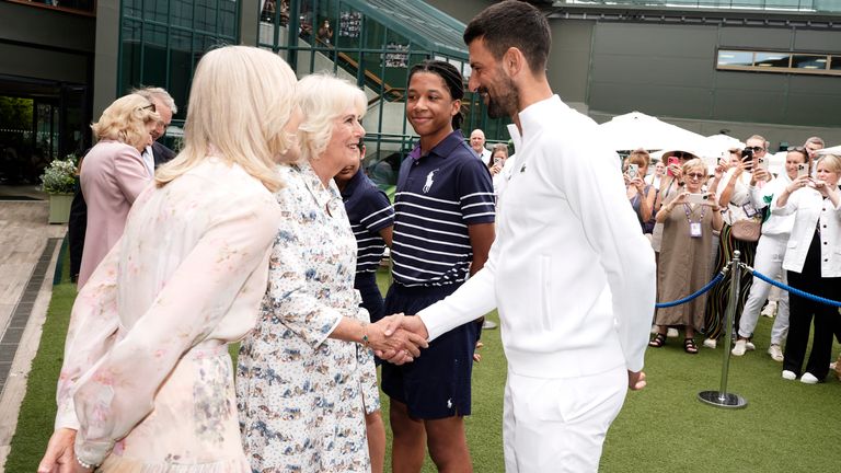 Queen Camilla speaks with Novak Djokovic.
Pic: PA
