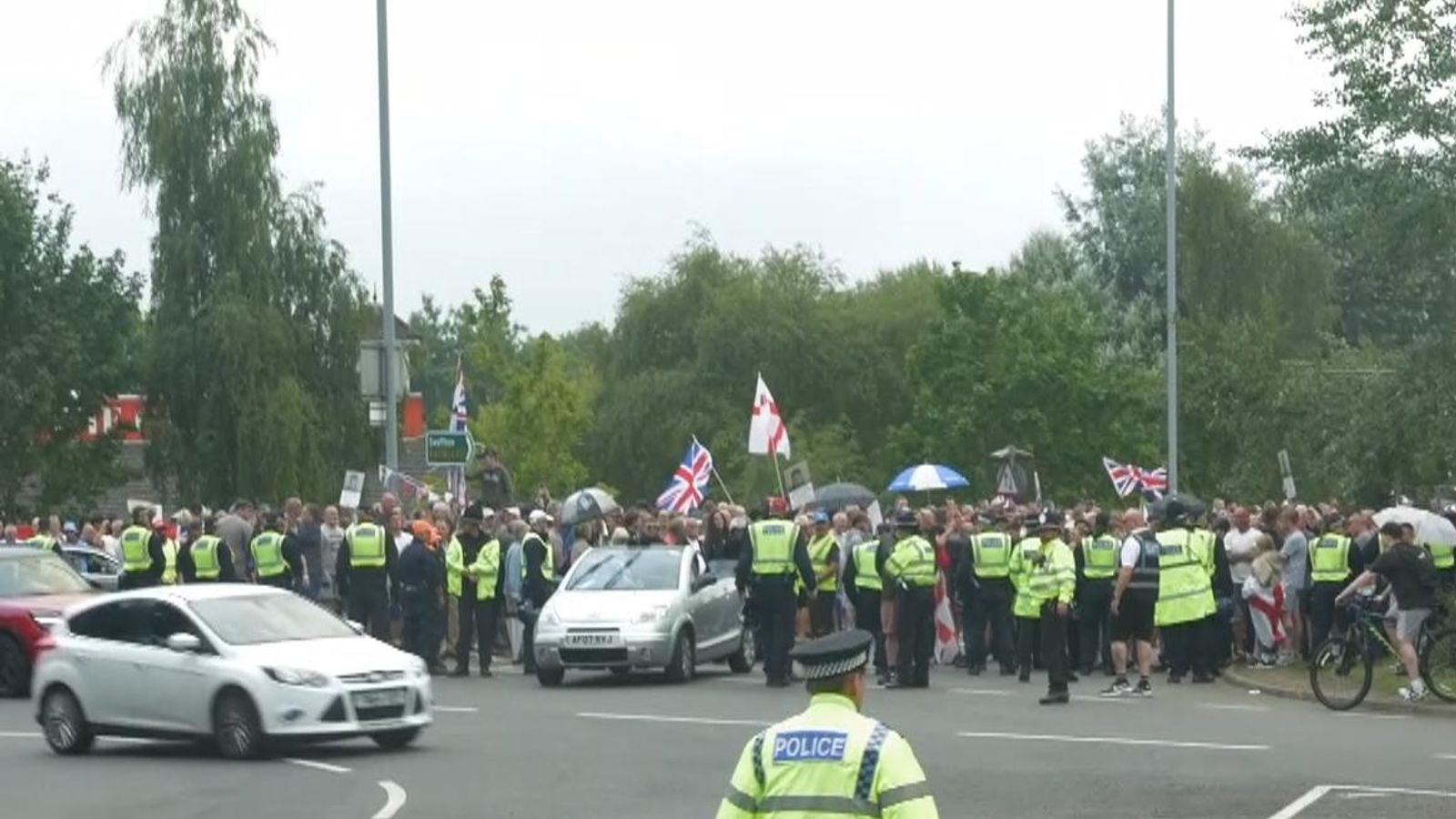Anti-immigrant protests gather at a roundabout in Norwich