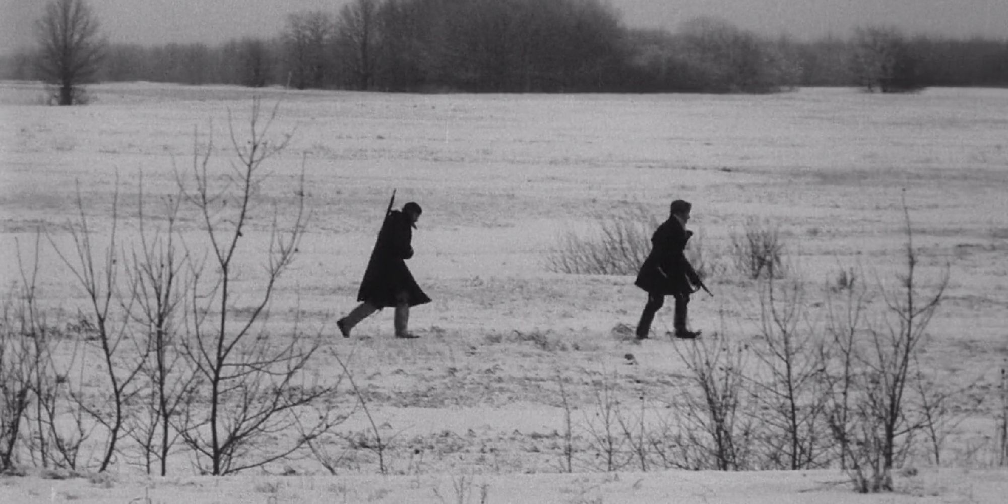 Two figures crossing the snow in The Ascent - 1977