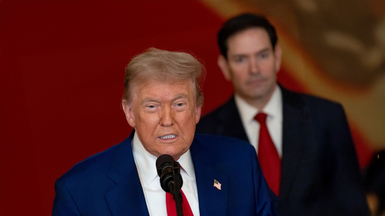 Donald Trump, with Marco Rubio in the background.