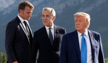 From left, French President Emmanuel Macron, Canadian Prime Minister Mark Carney and President Donald Trump arrive for the family photograph during the G7 Summit in Kananaskis, Alberta, June 16, 2025. (Adrian Wyld/The Canadian Press via AP, File)