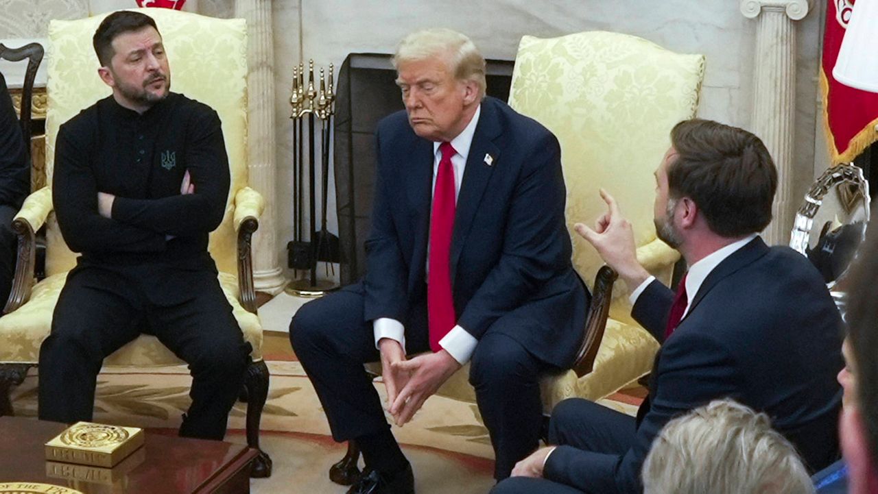 U.S. Vice President JD Vance, right, speaks with Ukrainian President Volodymyr Zelenskyy, left, as President Donald Trump listens, in the Oval Office at the White House on Feb. 28, 2025, in Washington. (AP Photo/ Mystyslav Chernov, File)