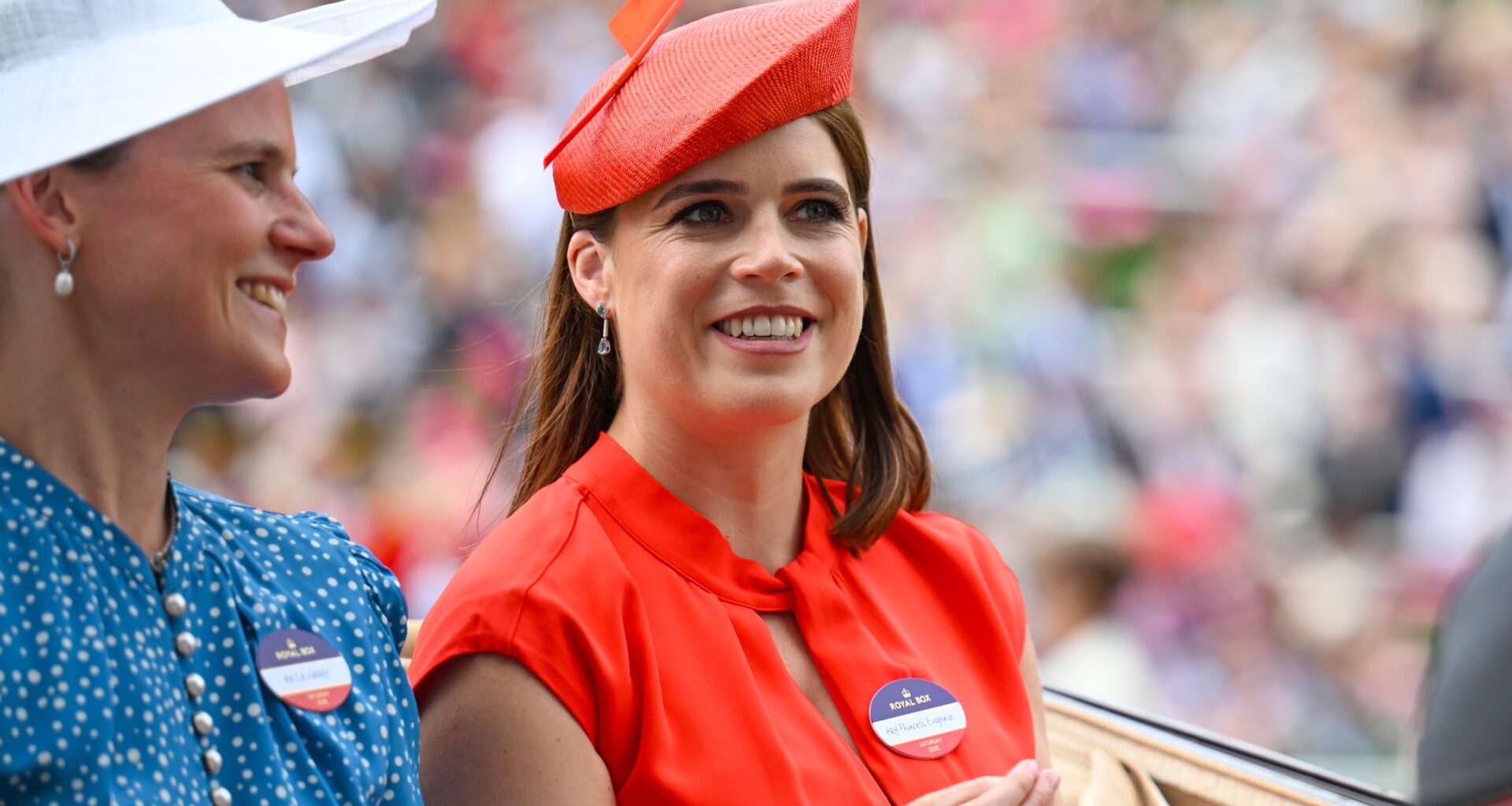 Camilla Walker and Princess Eugenie of York ride in a carriage as they attend day five of Royal Ascot