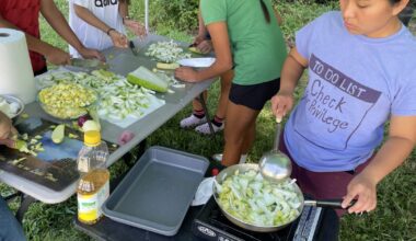 Young refugees start hot meals operation to help feed public housing residents displaced by Chantal