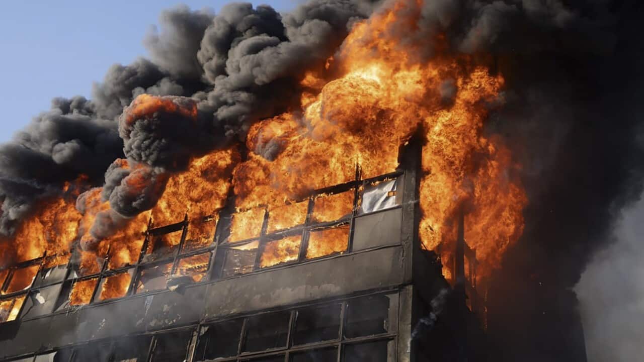 Flames engulfing a building
