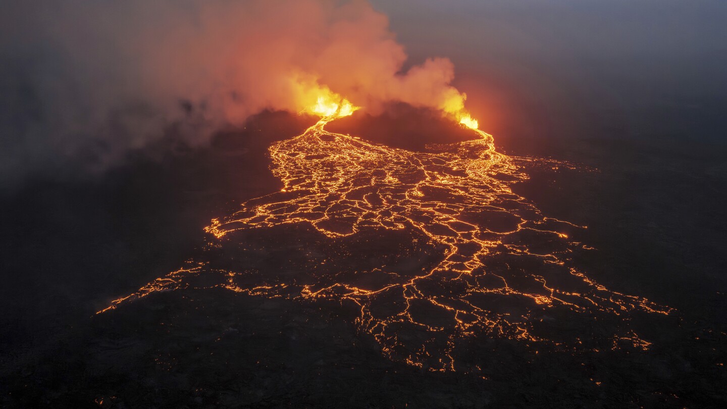 Tourists watch spectacular volcanic eruptions in Iceland