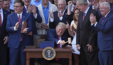 Trump signs his tax and spending cut bill at White House picnic
