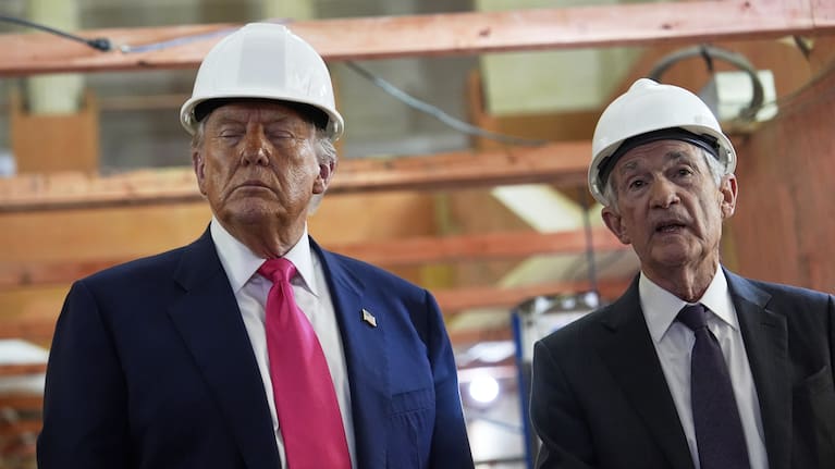 US President Donald Trump listens as Federal Reserve Chairperson Jerome Powell speaks during a visit to the Federal Reserve.