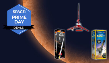 Three model rockets are in a triangle formation, the bottom two are in their box, all on a orange planet background with the space.com logo in the top left corner.