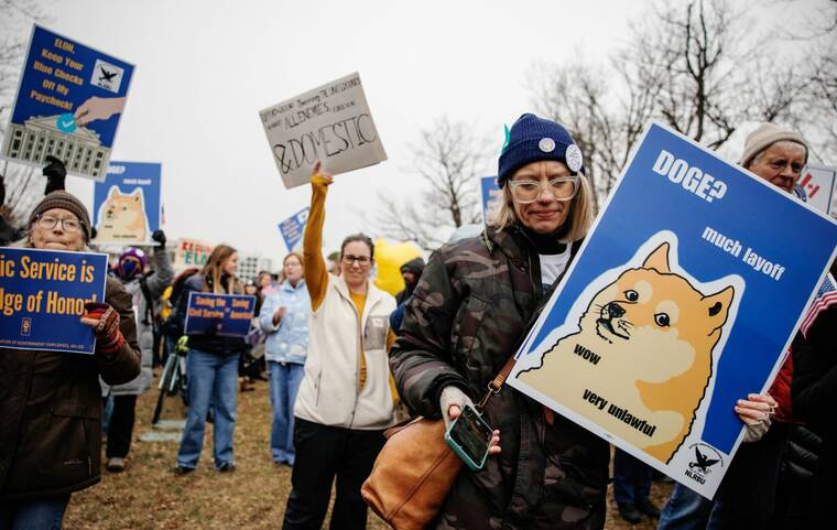 SAMUEL CORUM/THE NEW YORK TIMES
Demonstrators protest government workforce reductions by the Trump administration and the Department of Government Efficiency (DOGE) in Washington, on Feb. 11. At least eight core members of the U.S. Department of Government Efficiency (DOGE) have left their positions in the last six months, Politico reported today, citing internal records and sources familiar with the matter.