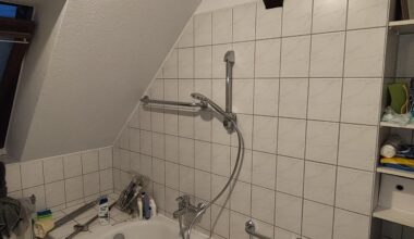 Just moved in, bathroom's like this. Any ideas for a curtain rod?