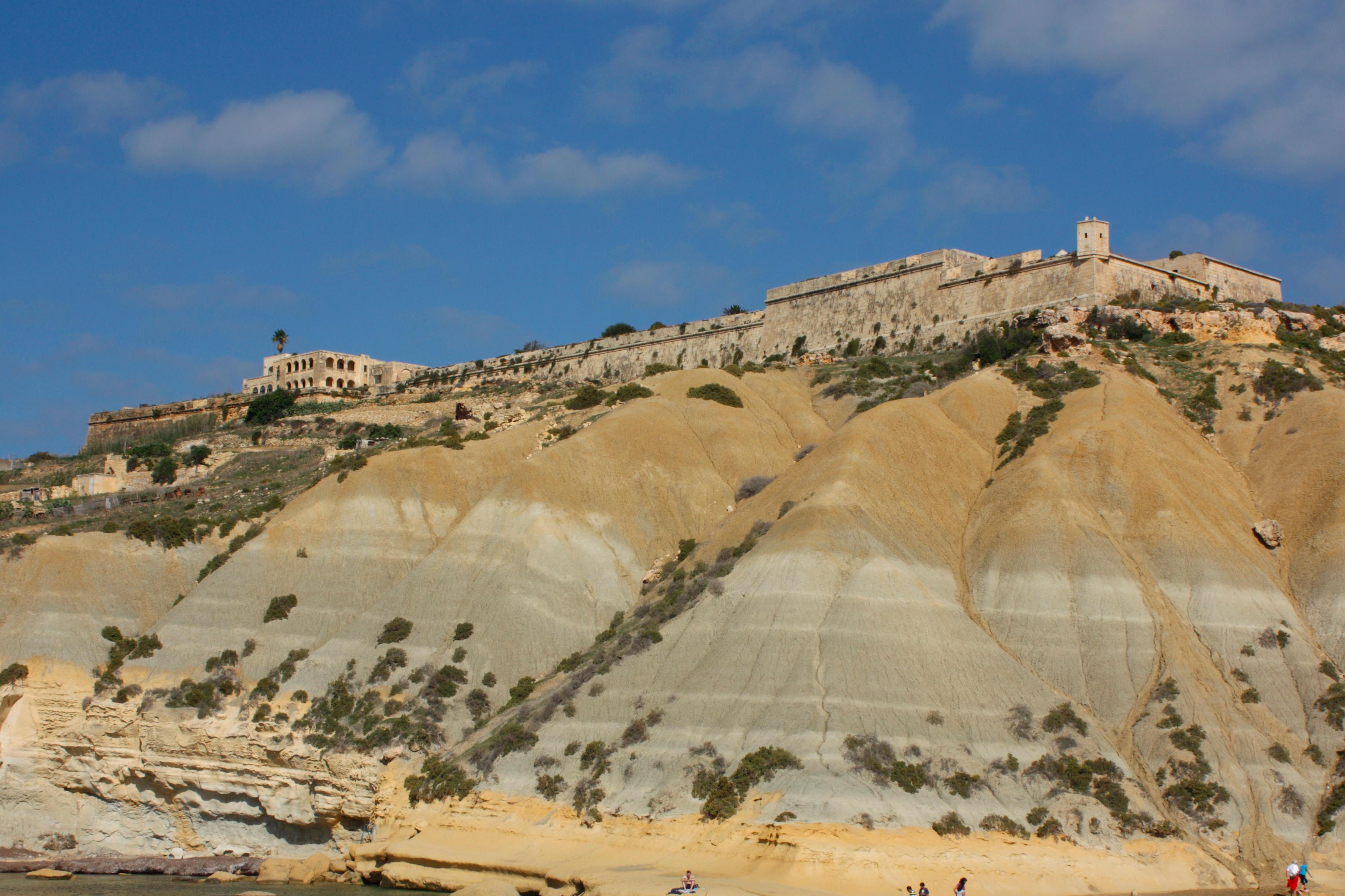 Fort Chambray overlooking cliffs and coastline in Gozo, Malta.