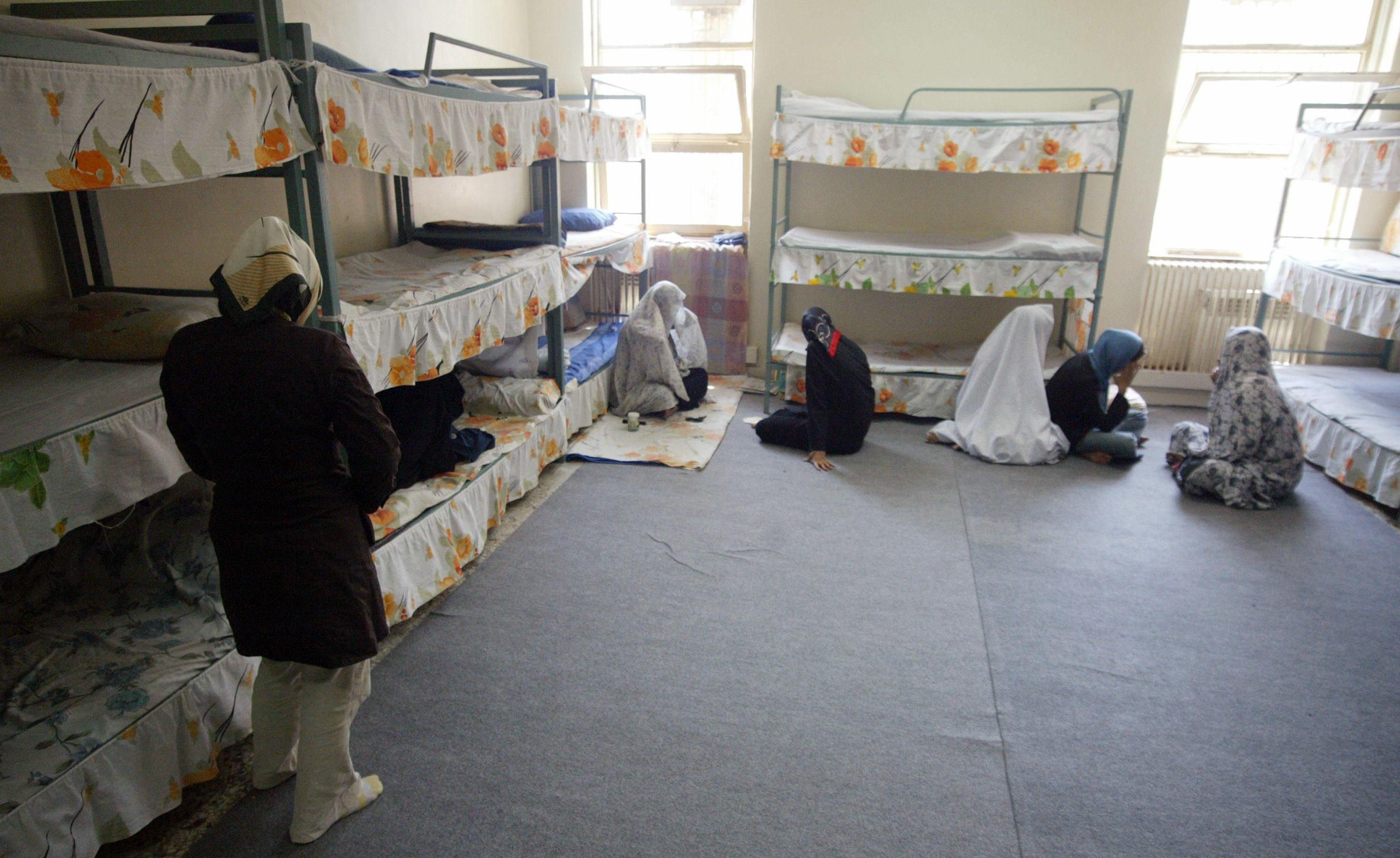 Iranian women prisoners in Evin prison covering their faces.