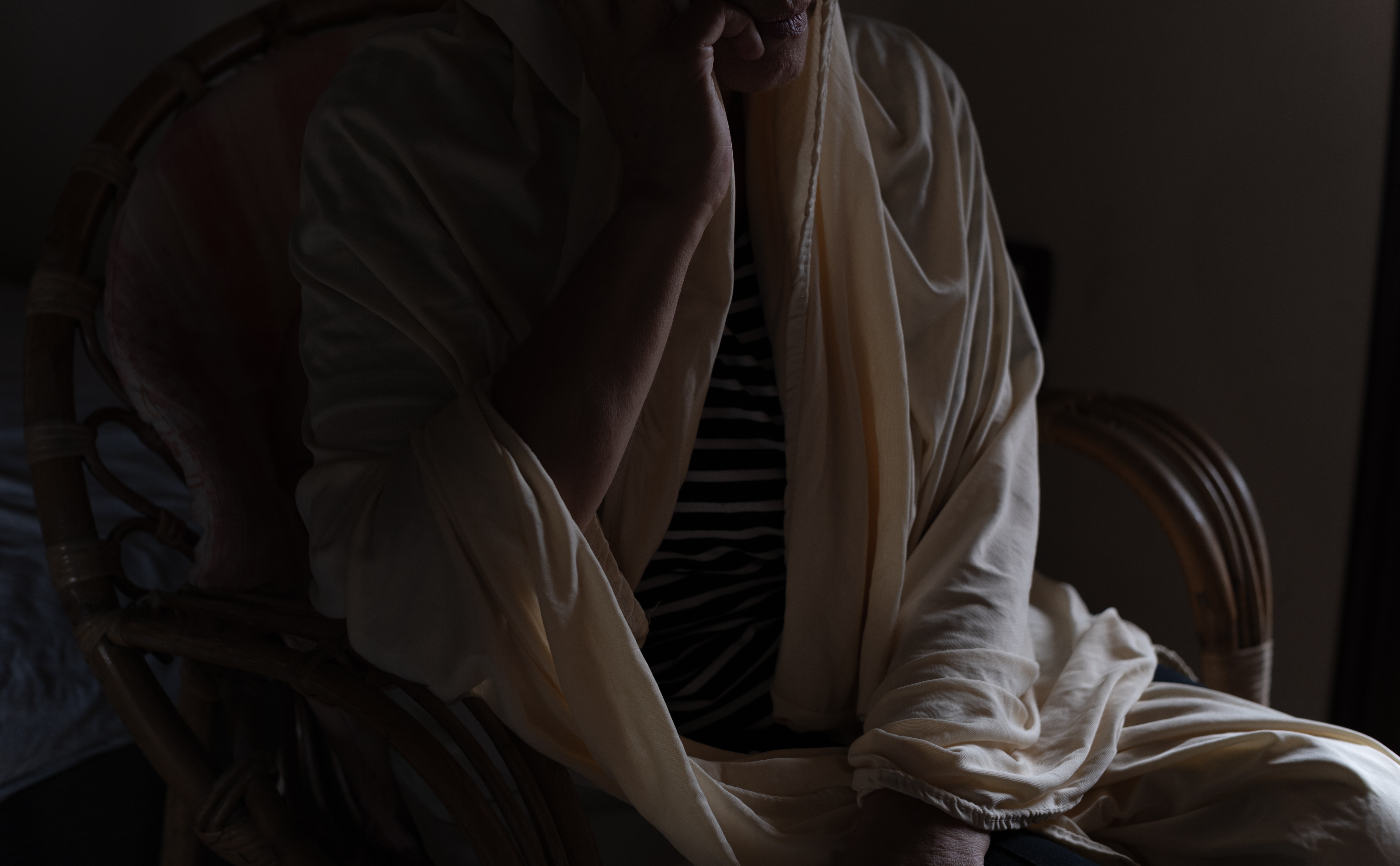 Alawite woman in hiding, wearing a hijab.