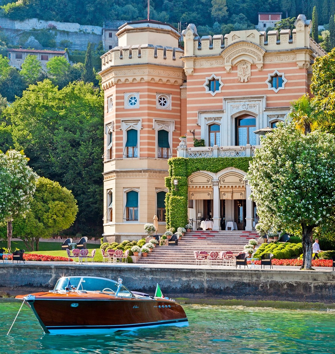 Villa Feltrinelli in Gargnano, Italy, with a boat in the foreground.