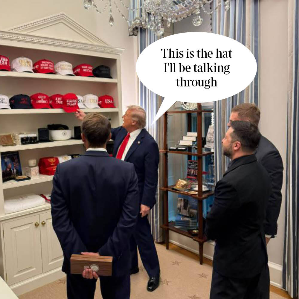 Trump showing a collection of hats.