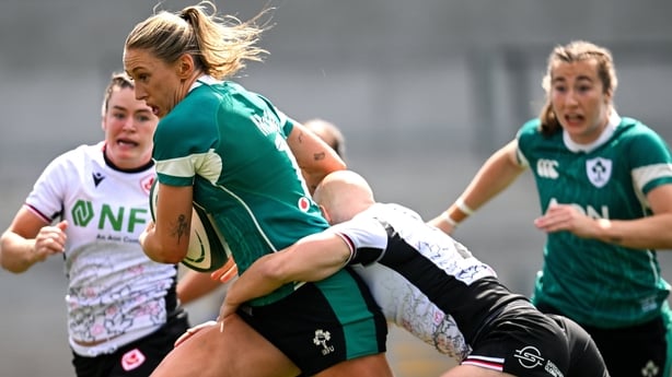 9 August 2025; Anna McGann of Ireland on her way to scoring her side's third try despite the tackle of Olivia Apps of Canada during the Women's Rugby World Cup warm-up match between Ireland and Canada at Affidea Stadium in Belfast. Photo by Ramsey Cardy/Sportsfile