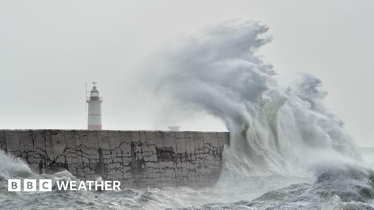 Large waves crashing on Newhaven Breakwater Light at Newhaven Harbour, East Sussex
