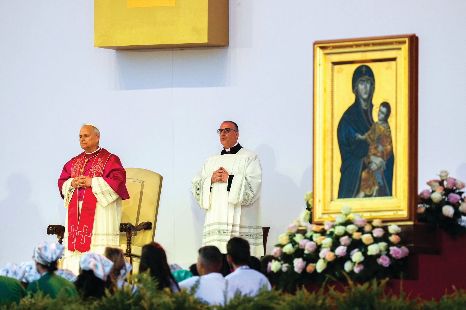 Above, Pope Leo XIV begins the vigil with thousands of young people gathered in Tor Vergata in Rome Aug. 2, 2025, during the Jubilee of Youth. Below, Pope Leo XIV responds to a question from a young person during the vigil. (CNS photos/Lola Gomez)