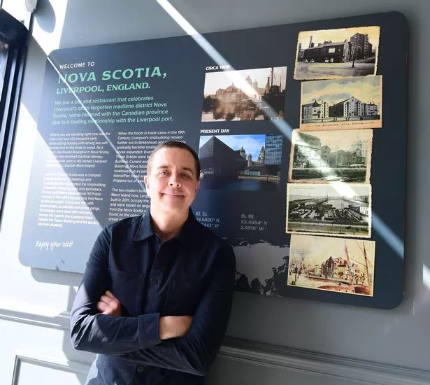 Novia Scotia Restaurant Director Iain Hoskins,with picture board celebrating the history of 'Little Novia Scotia' at Mann Island