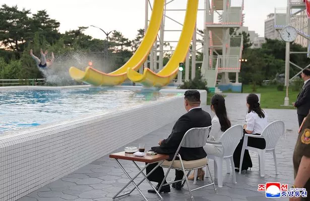 Kim watches on to make sure everyone is enjoying themselves