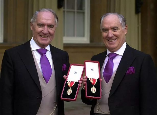 Sir David Barclay (left) and his twin brother Sir Frederick after receiving their knighthoods from the Queen at Buckingham Palace