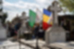 People queue in a cemetery as they visit the tomb of Ilie Lacatusu, one of the Romanian Orthodox Church's latest saints, bearing the flag with the insignia of the Iron Guard, one of Europe's most violent antisemitic movements in the 20th century, in Bucharest, Romania April 13, 2025. REUTERS/Andreea Campeanu/File Photo