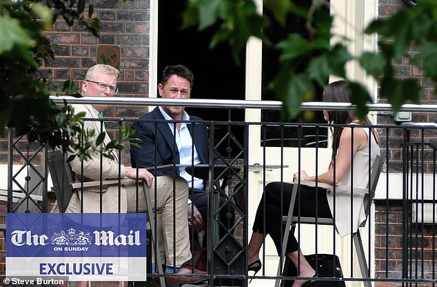 King Charles and Prince Harry's senior aides held a secret peace summit in London (pictured: the head of communications for Royal Family Tobyn Andreae (left) and Meredith Maines head of communications for The Sussexes (right) with Liam Maguire, who runs the Sussexes' PR team in the UK (centre)