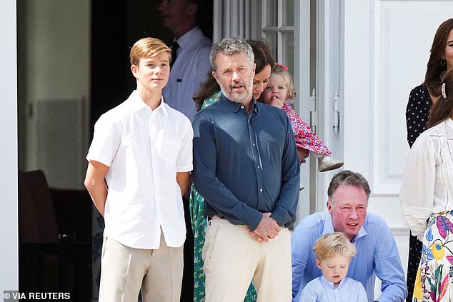 She was accompanied by her husband, King Frederik, who cut a dashing figure in a crisp blue button-up shirt paired with tan trousers