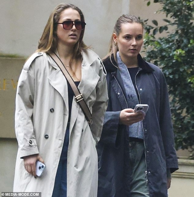 Ingrid Alexandra dress simply for her day time outing in a long coat with fur collar, baggy green jeans, a grey zip up sweater, and blue knit top